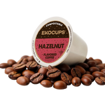 Ekocups Hazelnut flavored coffee pod surrounded by coffee beans on a white background