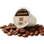 Ekocups compostable coffee pod with half-caff label surrounded by coffee beans on a white background